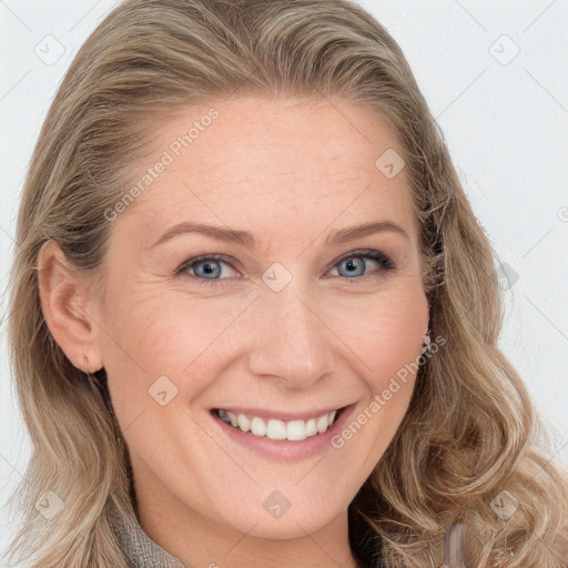 Joyful white young-adult female with long  brown hair and blue eyes