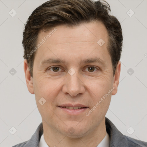 Joyful white adult male with short  brown hair and grey eyes