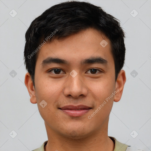 Joyful asian young-adult male with short  brown hair and brown eyes