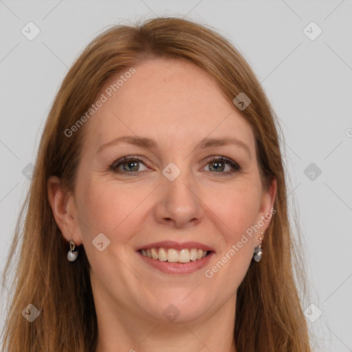 Joyful white adult female with long  brown hair and grey eyes