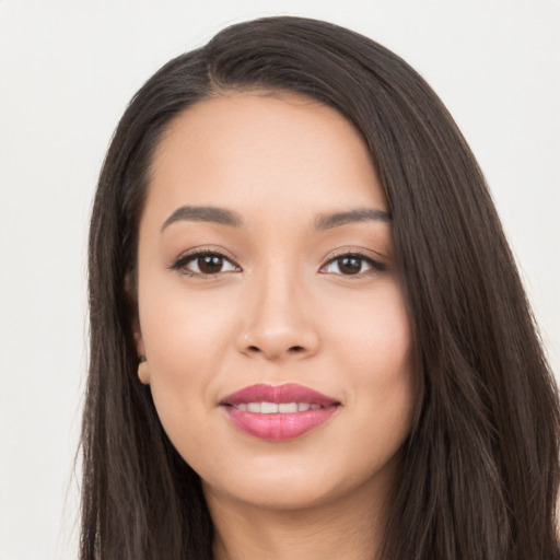 Joyful white young-adult female with long  black hair and brown eyes