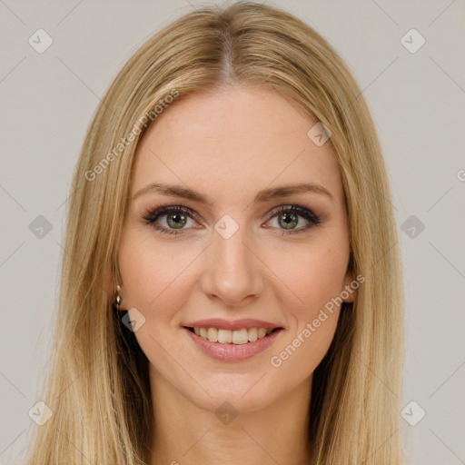 Joyful white young-adult female with long  brown hair and green eyes