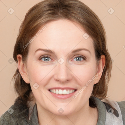 Joyful white young-adult female with medium  brown hair and blue eyes