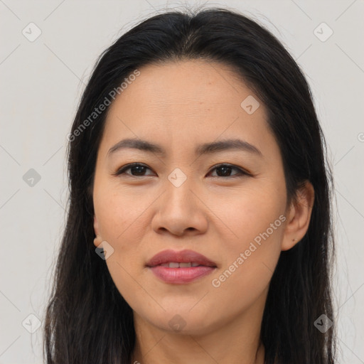 Joyful asian young-adult female with long  brown hair and brown eyes