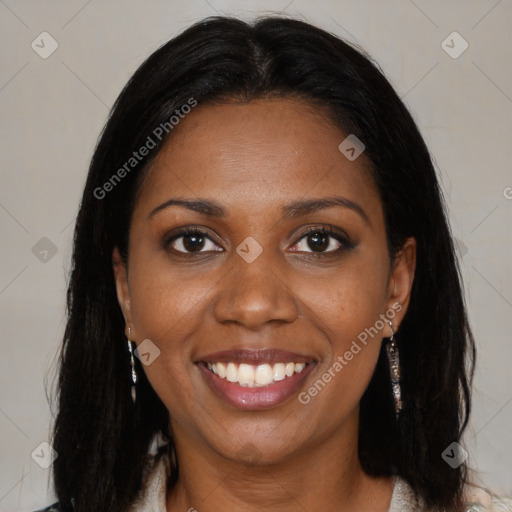 Joyful black young-adult female with long  brown hair and brown eyes