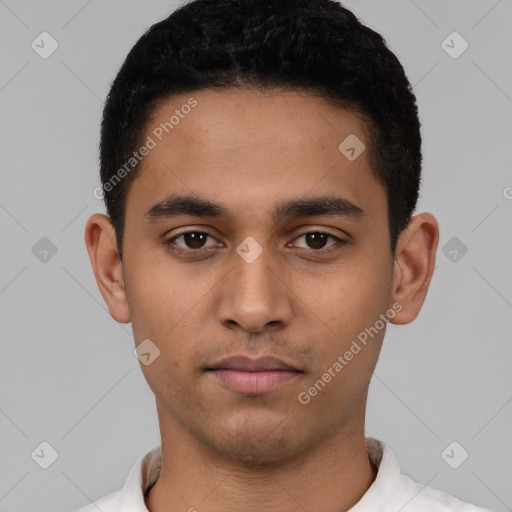 Neutral latino young-adult male with short  black hair and brown eyes