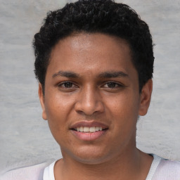 Joyful white young-adult male with short  black hair and brown eyes