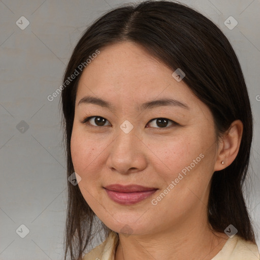 Joyful white adult female with medium  brown hair and brown eyes