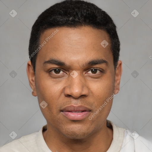 Joyful black young-adult male with short  black hair and brown eyes