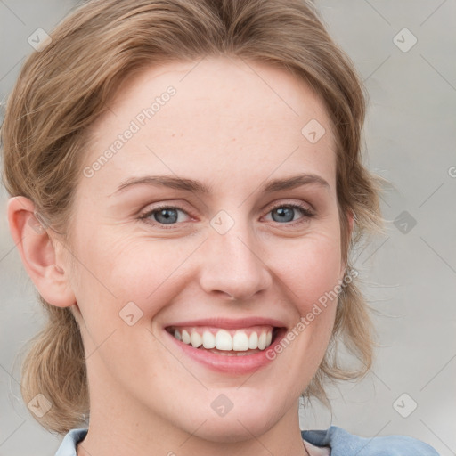 Joyful white young-adult female with medium  brown hair and blue eyes