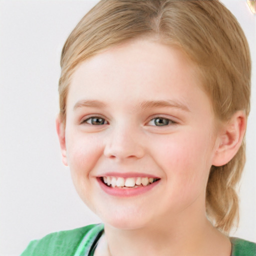 Joyful white child female with short  brown hair and blue eyes