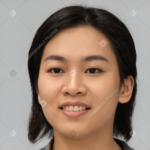 Joyful asian young-adult female with medium  black hair and brown eyes