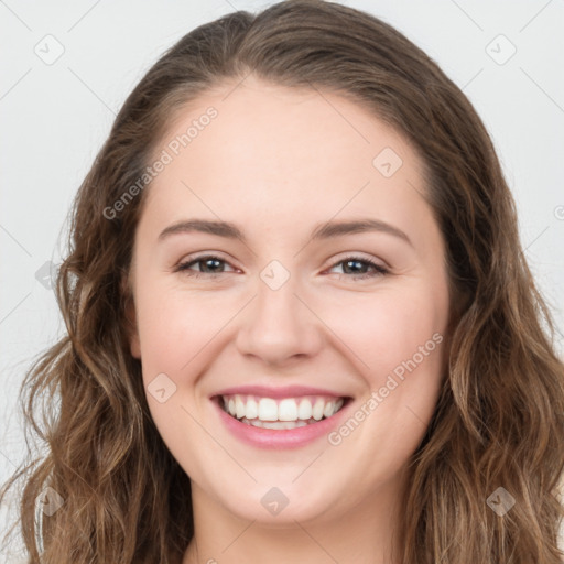 Joyful white young-adult female with long  brown hair and green eyes