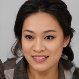 Joyful asian young-adult female with medium  brown hair and brown eyes