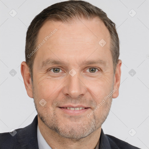 Joyful white adult male with short  brown hair and brown eyes