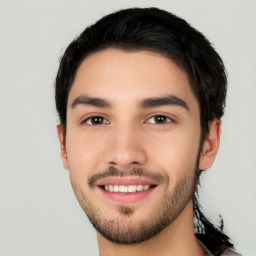 Joyful white young-adult male with short  black hair and brown eyes