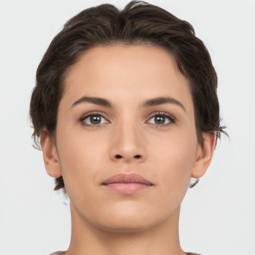 Neutral white young-adult female with short  brown hair and brown eyes