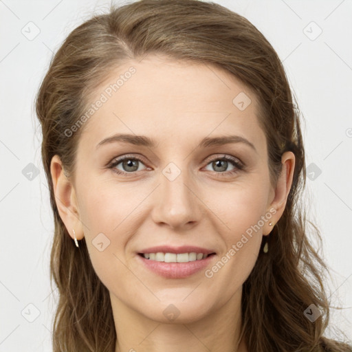 Joyful white young-adult female with long  brown hair and grey eyes