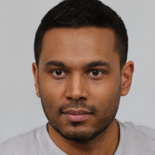 Neutral latino young-adult male with short  black hair and brown eyes
