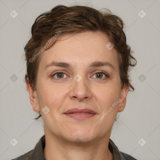 Joyful white adult female with short  brown hair and grey eyes