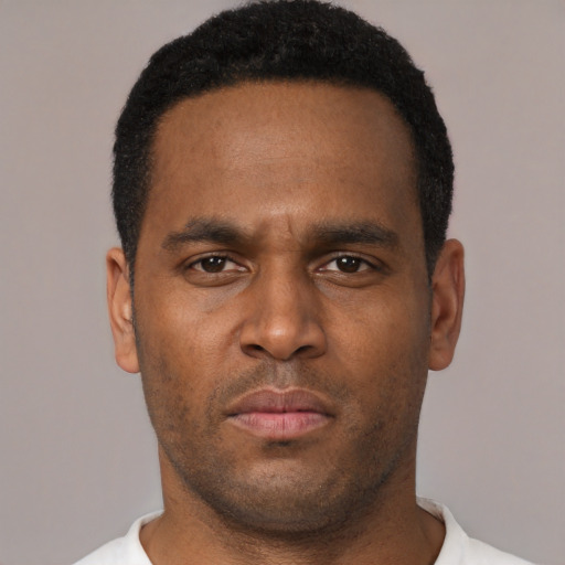 Neutral black young-adult male with short  brown hair and brown eyes