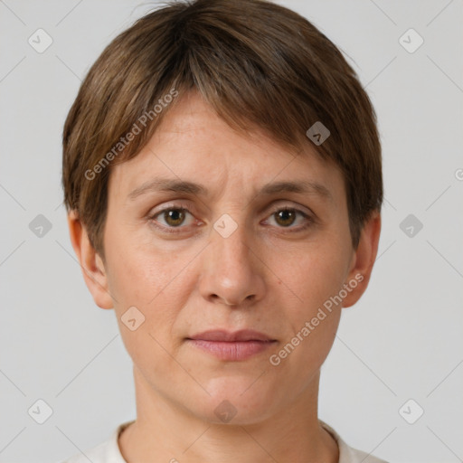 Joyful white adult female with short  brown hair and grey eyes