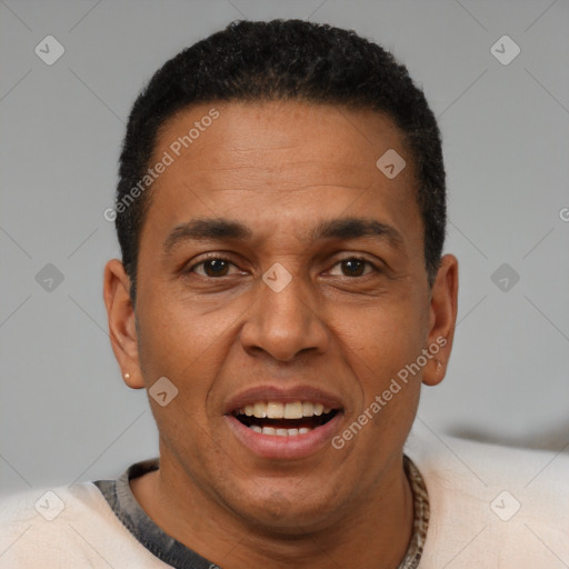 Joyful black adult male with short  black hair and brown eyes