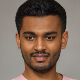 Joyful latino young-adult male with short  black hair and brown eyes