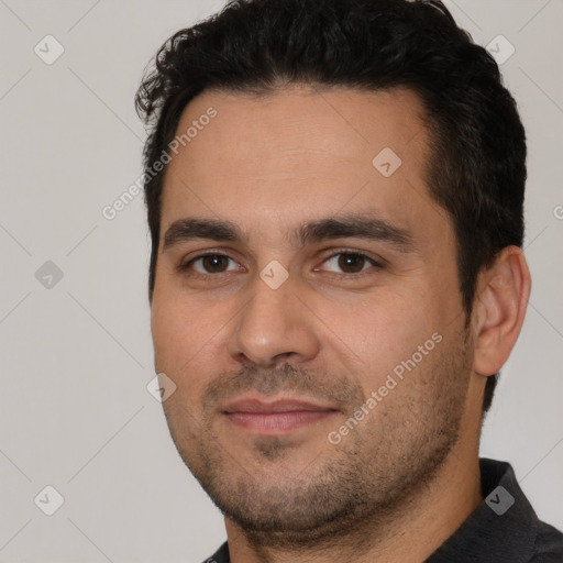 Joyful white young-adult male with short  black hair and brown eyes