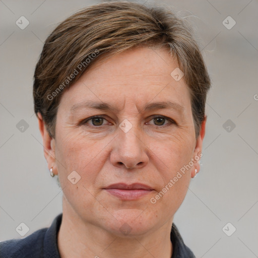 Joyful white adult female with short  brown hair and grey eyes