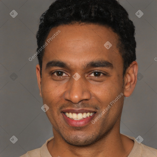 Joyful black young-adult male with short  black hair and brown eyes