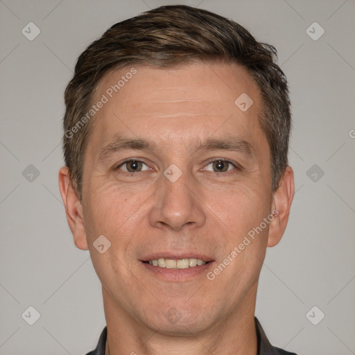 Joyful white adult male with short  brown hair and brown eyes