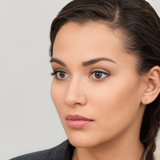 Neutral white young-adult female with long  brown hair and brown eyes