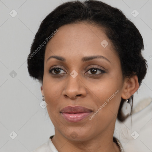 Joyful latino adult female with short  brown hair and brown eyes