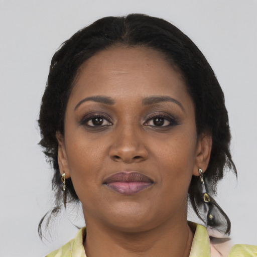 Joyful black young-adult female with medium  black hair and brown eyes