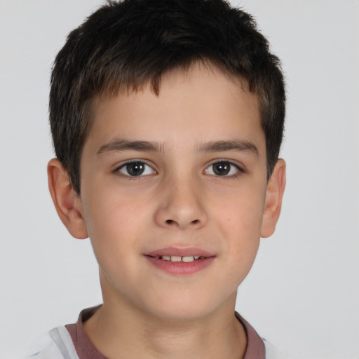 Joyful white child male with short  brown hair and brown eyes