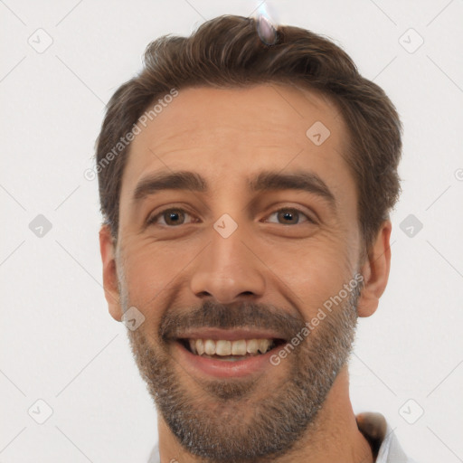 Joyful white young-adult male with short  brown hair and brown eyes