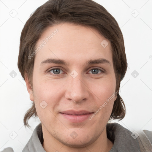 Joyful white young-adult female with short  brown hair and grey eyes