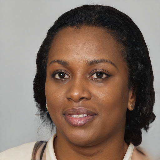 Joyful black young-adult female with medium  black hair and brown eyes