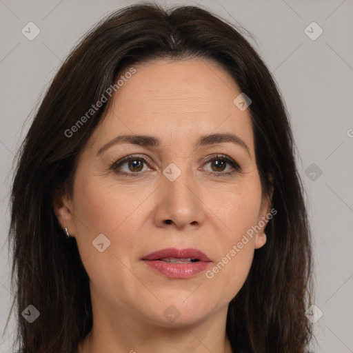 Joyful white adult female with medium  brown hair and brown eyes