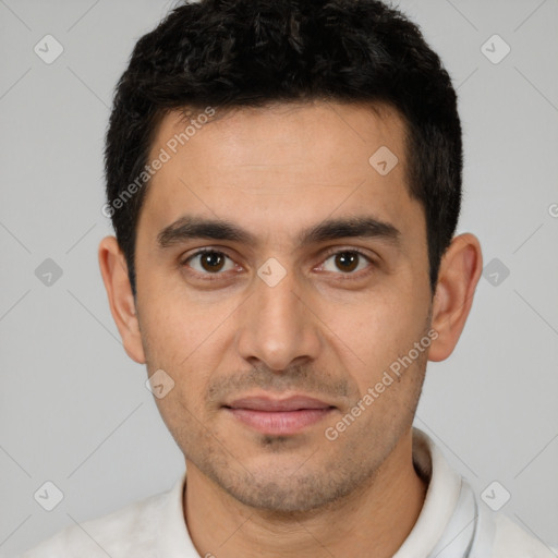 Joyful white young-adult male with short  black hair and brown eyes