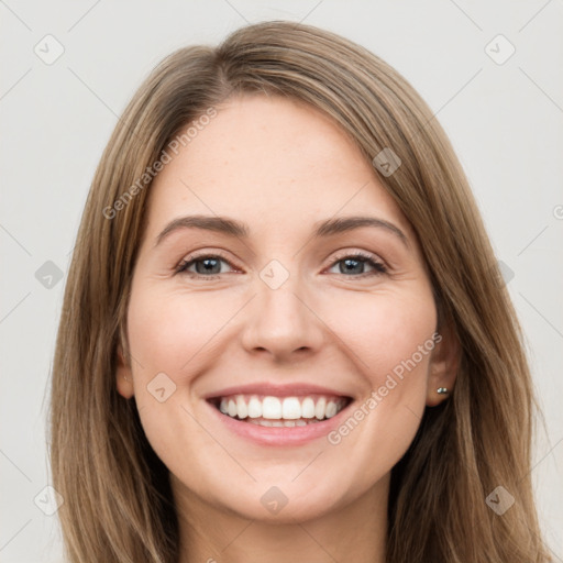 Joyful white young-adult female with long  brown hair and green eyes