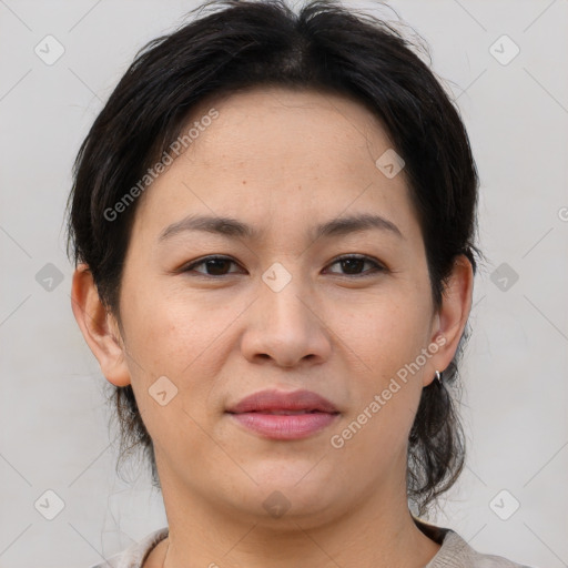 Joyful asian young-adult female with medium  brown hair and brown eyes