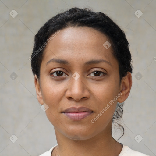 Joyful latino young-adult female with short  black hair and brown eyes