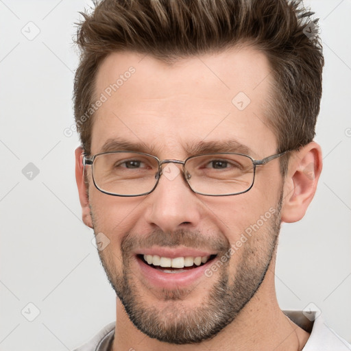 Joyful white adult male with short  brown hair and grey eyes