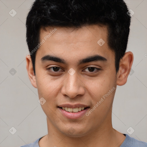 Joyful asian young-adult male with short  black hair and brown eyes