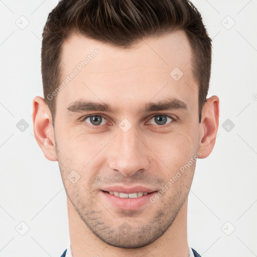 Joyful white young-adult male with short  brown hair and grey eyes