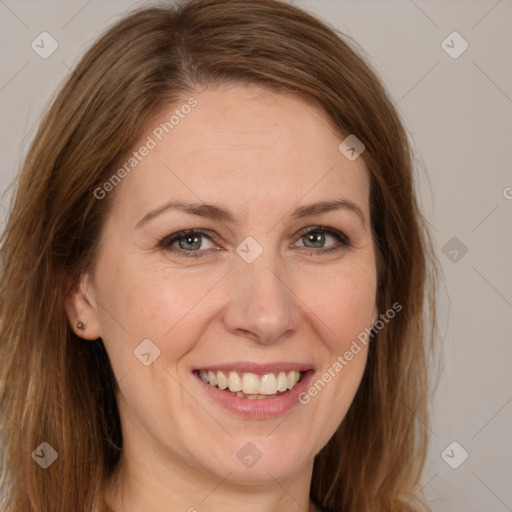 Joyful white adult female with long  brown hair and brown eyes