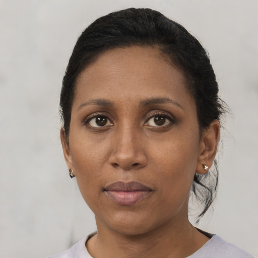 Neutral black adult female with short  black hair and brown eyes