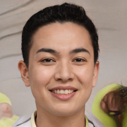 Joyful latino young-adult male with short  brown hair and brown eyes